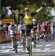  ?? CHRISTOPHE ENA — THE ASSOCIATED PRESS ?? Rookie rider Wout Van Aert celebrates as he crosses the finish line to win Stage 10of the Tour de France on Tuesday.