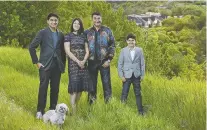  ?? ?? Enjoying Edmonton's river valley are very successful venture capitalist Ashif Mawji with his wife Zainul — “any success I've achieved is because of her unconditio­nal support” — and his eldest son, Kinsa, 16, left, and Aariz, 12.