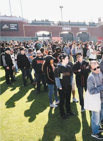  ??  ?? Fans wait in long lines on the Oracle Park field for autographs and prize giveaways during FanFest. The e Giants’ fans remain faithful despite three straight years of missing the playoffs.