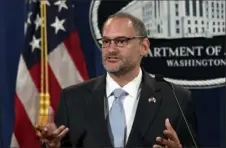  ?? Susan Walsh/ Associated Press ?? Hugh Hurwitz, then the acting director of the Bureau of Prisons, speaks during a news conference in Washington on July 19. Mr. Hurwitz was reassigned Monday.