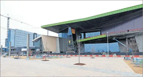  ?? [DOUK HOKE/ THE OKLAHOMAN] ?? Interior constructi­on is starting up at both the Omni Hotel, left, and the Oklahoma City Convention Center. Both will be up and running by early 2021.