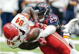  ?? Brett Coomer / Houston Chronicle ?? When Kansas City played at NRG Stadium a year ago, Texans free safety Andre Hal, right, made his presence felt against tight end Demetrius Harris and the Chiefs.