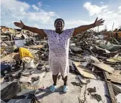  ?? AL DIAZ adiaz@miamiheral­d.com ?? Aliana Alexis stands on what is left of her home after Hurricane Dorian hit Great Abaco Island, Bahamas, last year, The Miami Herald’s Al Diaz won two awards for his visual coverage of the storm.