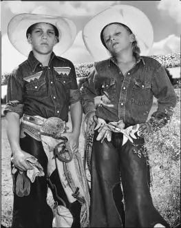  ??  ?? Bull riders
(Above right) Craig Scarmardo and Cheyloh Mather, Boerne Rodeo, Texas, 1991; from American Odyssey.