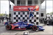  ?? VASHA HUNT — THE ASSOCIATED PRESS ?? Alex Palou celebrates on Victory Lane after winning the Honda Indy Grand Prix of Alabama on April 18 at Barber Motorsport­s Parkway in Birmingham, Ala.