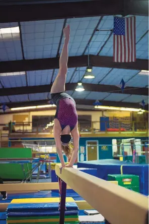  ?? COURTESY OF VITALIY GRYRA ?? Brianna Fryar says competing against other gymnastic clubs at meets makes her feel as if she is working toward something.