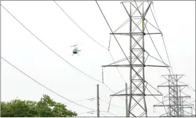  ?? COURTESY ITC ?? ITC will be conducting aerial patrols of its of its high-voltage transmissi­on structures and lines across Michigan now through June 8. So, don’t be alarmed if you see a helicopter flying low overhead.