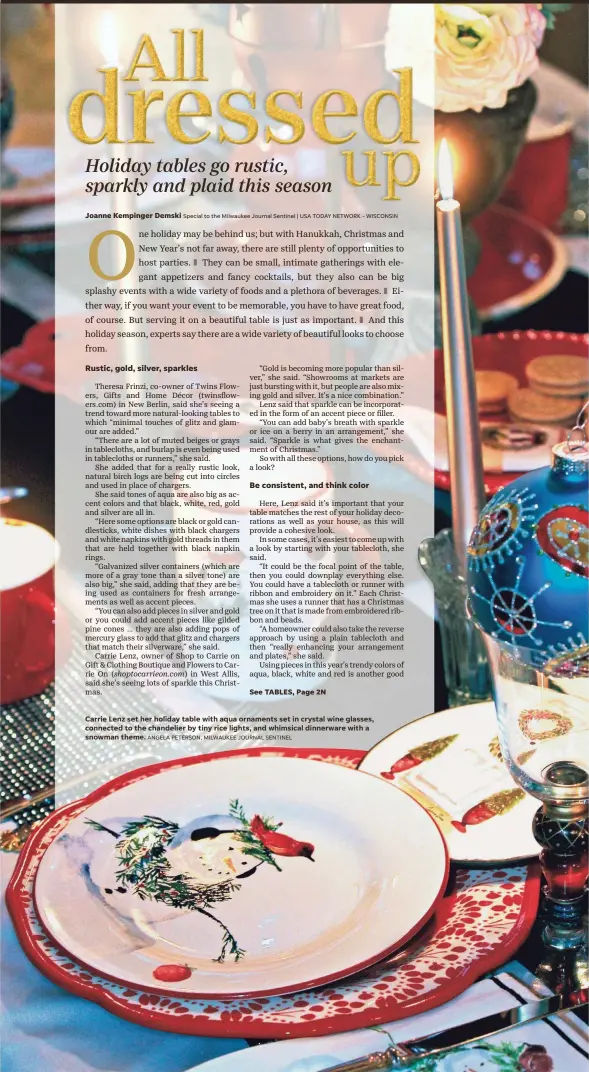  ?? ANGELA PETERSON, MILWAUKEE JOURNAL SENTINEL ?? Carrie Lenz set her holiday table with aqua ornaments set in crystal wine glasses, connected to the chandelier by tiny rice lights, and whimsical dinnerware with a snowman theme.