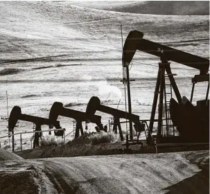  ?? Associated Press file photo ?? Oil prices have crashed globally, down 73 percent this year after benchmark West Texas Intermedia­te futures went negative earlier this week.