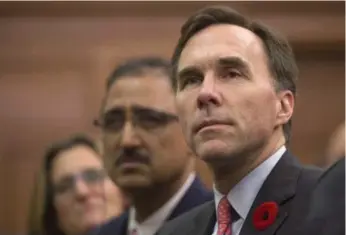  ?? SEAN KILPATRICK/THE CANADIAN PRESS ?? Finance Minister Bill Morneau announced the middle-class tax cut at press conference on Dec. 7.