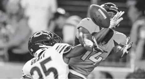  ?? Aaron Ontiveroz, The Denver Post ?? Doran Grant of the Chicago Bears gets called for pass interferen­ce as he defends Broncos rookie Courtland Sutton during the first half Saturday night at Broncos Stadium at Mile High. Denver lost 24-23 to fall to 0-2 during the preseason.