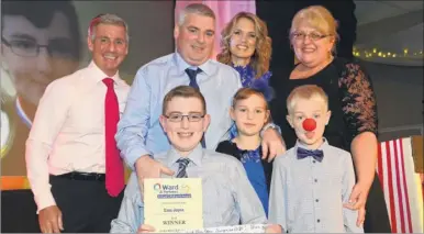  ?? Picture: Gary Browne FM4542741 Buy pictures from kentonline.co.uk ?? Charlotte Hawkins and financial director Keith Lovell present the award for Triumph Over Adversity (12-16 years) to Sam Joyce and his family