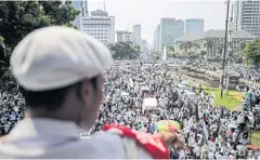  ?? EPA ?? Thousands of Indonesian Muslims attend a rally held to commemorat­e the ‘212’ rallies against former Jakarta Governor Basuki ‘Ahok’ Tjahaja Purnama in Jakarta.