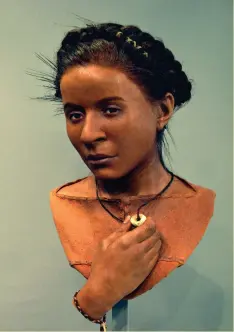  ??  ?? Left: A new archaeolog­y gallery at Brighton Museum & Art Gallery (Briefing Mar/Apr 2019/165) features seven facial reconstruc­tions, among them this woman based on a skull from Whitehawk. Her adna has not been analysed, but on evidence from contempora­ry genomes she would probably have had skin of a southern Mediterran­ean/Near Eastern/North African colour, brown hair and brown eyes. The depiction of the Neolithic site by Grant Cox of ArtasMedia was also created for the new displays