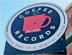  ?? (Special to the Democrat-Gazette/Marcia Schnedler) ?? Coffee Records’ sign alerts visitors that it sells music as well as beverages.