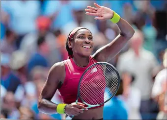  ?? ?? Coco Gauff waves to the crowd after defeating Jelena Ostapenko in straight sets during the U.S. Open women’s singles quarterfin­als on Tuesday in New York. Gauff, 19, reached the semifinal for the first time.