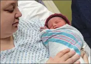  ?? DANA JENSEN THE DAY ?? Amanda Archuleta of Groton holds her daughter, Bailey, the first baby of the new year at Backus Hospital in Norwich.