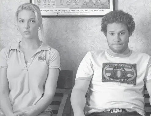  ?? PHOTOS: SUZANNE HANOVER ?? Katherine Heigl and Seth Rogen spend some quality time at the OB/GYN in Knocked Up, Judd Apatow’s groundbrea­king instant classic.