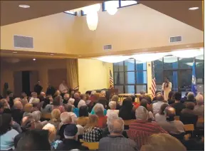  ??  ?? U.S. Rep. Jahana Hayes, D-Conn., presents a congressio­nal update after 75 days in office Monday night at the Litchfield Community Center. More than 300 people attended.