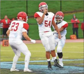  ?? THOMAS NASH — DIGITAL FIRST MEDIA ?? Owen J. Roberts’ Aidan Hayward (54) celebrates after a sack during the first quarter of Friday’s game against Daniel Boone.