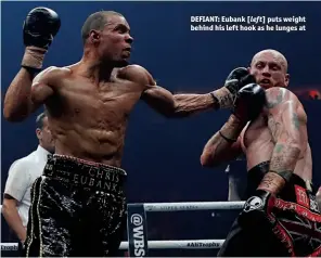  ?? Photos: ACTION IMAGES/ANDREW COULDRIDGE ?? DEFIANT: Eubank [left] puts weight behind his left hook as he lunges at