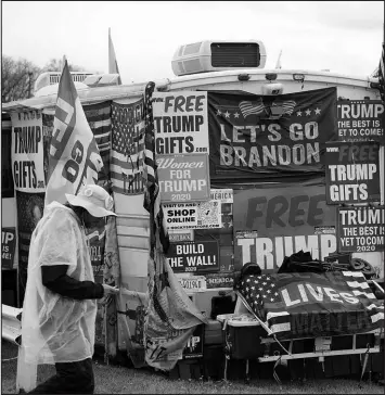  ?? GENE J. PUSKAR / ASSOCIATED PRESS ?? Trump merchandis­e is displayed for sale May 6 during a campaign rally at the Westmorela­nd Fair Grounds in Greensburg, Pa.