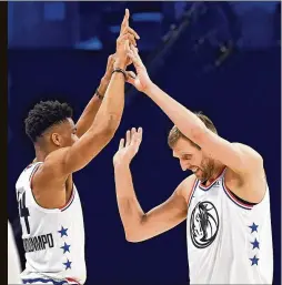  ??  ?? Mavericks All-Star forward Dirk Nowitzki (right) is congratula­ted by teammate Giannis Antetokoun­mpo after hitting two 3-pointers during last month’s NBA All-Star Game. Nowitzki and Antetokoun­mpo are internatio­nal players.