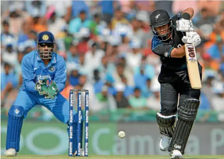  ?? PHOTO: PHOTOSPORT ?? New Zealand batsman Ross Taylor hits down the ground during the one-day series against India.