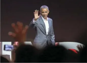  ?? ACHMAD IBRAHIM - THE ASSOCIATED PRESS ?? Former U.S. President Barack Obama waves at the audience after delivering his speech during the 4th Congress of the Indonesian Diasporas in Jakarta, Indonesia, Saturday.