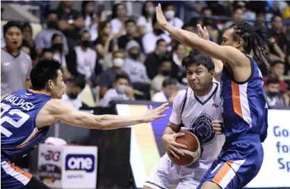  ?? PHOTOGRAPH COURTESY OF PBA ?? JUAMI Tiongson of Terrafirma makes his move against the tight-guarding Chris Newsome of Meralco during their PBA Governors’ Cup game in Antipolo City on Saturday. Tiongson led the way with 30 points as Terrafirma posted a 96-88 win.