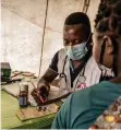  ??  ?? PHYSICIAN, Nazario Jaime, is seen during a consultati­on with a patient living in the Nicuapa site in Cabo Delgado province. The camp is now home to internally displaced people who have been forced to flee fighting in Mozambique’s northern most province.