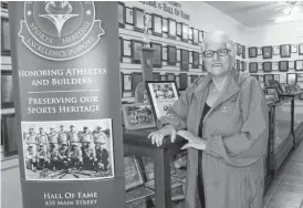  ??  ?? Gloria Goodwin, a director with the Yarmouth Town and County Sports Heritage Associatio­n, and a former president of the group in the associatio­n’s museum. ERIC BOURQUE