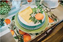  ?? Tribune News Service ?? ■ Juicy orange, electric yellow and vivid greens make for an energetic and fresh combinatio­n that will illuminate your space.