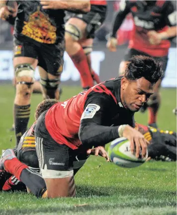  ?? PICTURE: BACKPAGE P IX ?? OVER THE LINE: Seta Tamanivalu of the Crusaders scores breaks past the tackle of Tawera Kerr-Barlow of the Chiefs in their Super Rugby semi-final encounter last weekend.