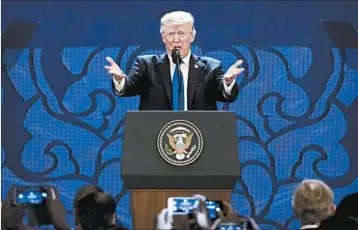  ?? MARK SCHIEFELBE­IN/AP ?? Despite U.S. efforts to open markets, other countries didn’t reciprocat­e, President Donald Trump tells his APEC audience.