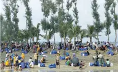  ?? AFP ?? Displaced Rohingya refugees from Myanmar rest near Ukhia, at the border between Bangladesh and Myanmar, as they flee violence. —