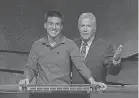  ??  ?? Former “Jeopardy!” champ James Holzhauer and host Alex Trebek