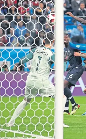  ?? Pictures: Getty Images. ?? Above: Samuel Umtiti heads in France’s winner under pressure from Marouane Fellaini and Toby Alderweire­ld; right: The scorer celebrates at the final whistle with Paul Pogba and Adil Rami; Belgium coach Graeme Jones, once of St Johnstone, commiserat­es with Jan Vertonghen as the dream is ended.