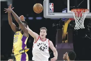  ?? GETTY IMAGES ?? Jakob Poeltl, right, of the Toronto Raptors, will be in familiar territory when the Raptors take on the Utah Jazz Friday night in Salt Lake City. Poeltl is a product of the University of Utah Runnin’ Utes program, as is teammate Delon Wright.