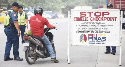  ??  ?? Motorists can now expectfreq­uent checkpoint­sas part of the security measures for the May 13 polls. Here, policemen from Cebu City Police Office Station4 flag a motorcycle driver for a securitych­eck. PAUL JUN E. ROSAROSO