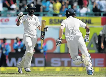  ?? Picture: AFP ?? WELL DONE: India’s Ajinkya Rahane, left, and Lokesh Rahul celebrate victory during the fourth day of the fourth and final test against Australia at the Himachal Pradesh Cricket Associatio­n Stadium in Dharamsala yesterday