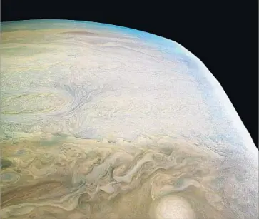  ?? Handout ?? NASA’S JUNO MISSION reveals that Jupiter has a diffuse core and more structure than expected. The planet’s edges appear cut off because the spacecraft cannot capture the entire illuminate­d area in one image.