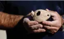  ?? ?? One of the clay lamps discovered during the excavation­s. Photograph: Ammar Awad/ Reuters