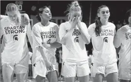  ?? Al Goldis Associated Press ?? MICHIGAN STATE players, from left, Stephanie Visscher, Moira Joiner, Theryn Hallock and Abbey Kimball stand together before their game against Maryland.