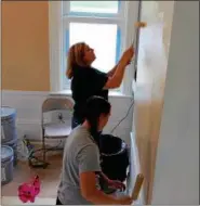  ?? TAWANA ROBERTS — THE NEWS-HERALD ?? On April 15 about 30 people volunteere­d to paint the Tikvah Recovery Home for Men, a recovery home in Willoughby that will provide alcohol-free and drug-free housing to men who are recovering from substance abuse.