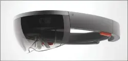  ??  ?? Microsofts AR-Brille Hololens projiziert digitale Gegenständ­e in die reale Umgebung: Das soll ein neues Spieleerle­bnis schaffen – zum Beispiel in Minecraft.