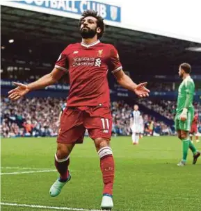  ?? REUTERS PIC ?? Liverpool’s Mohamed Salah celebrates his goal against West Bromwich Albion at The Hawthorns yesterday.