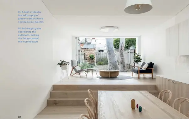  ??  ?? 03 A built-in planter box adds a pop of green to the kitchen’s neutral colour palette.
04 Full-height glass doors bring the outside in, making the living areas all the more relaxed. 04