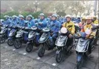  ?? LIAN GUOQING / FOR CHINA DAILY ?? Food couriers gather to advocate better traffic safety in Hangzhou, Zhejiang province, in November.