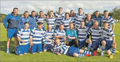  ?? Photo: Neil Paterson ?? UP FOR THE CUP: A jubilant Newtonmore squad celebrate their 3-1 Strathdear­n Cup final win over Glengarry